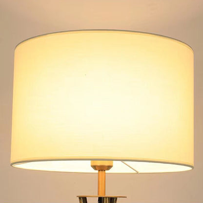 Nordic-style tripod floor lamp in iron and wood – Light-coloured cylindrical lampshade